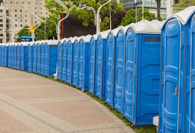 hygienic portable restrooms lined up at a beach party, ensuring guests have access to the necessary facilities while enjoying the sun and sand in Fargo